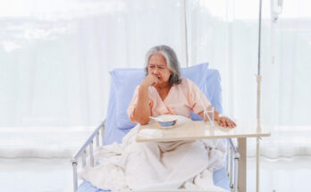 Asian elderly woman sick gastritis gastrointestinal disease enter hospital eating bland food porridge doesn't taste good lose your appetite sit look food bowl tired recuperating and sleeping hospital.
