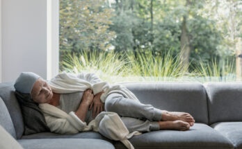 Weak elderly woman with cancer and stomach pain alone at home