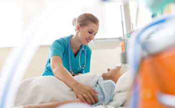 Senior patient and nurse in hospital