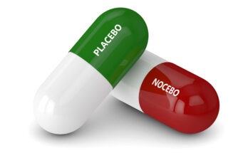 3D render of placebo and noicebo pills isolated over white background
