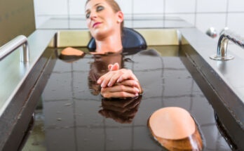 woman enjoying mud bath alternative therapy